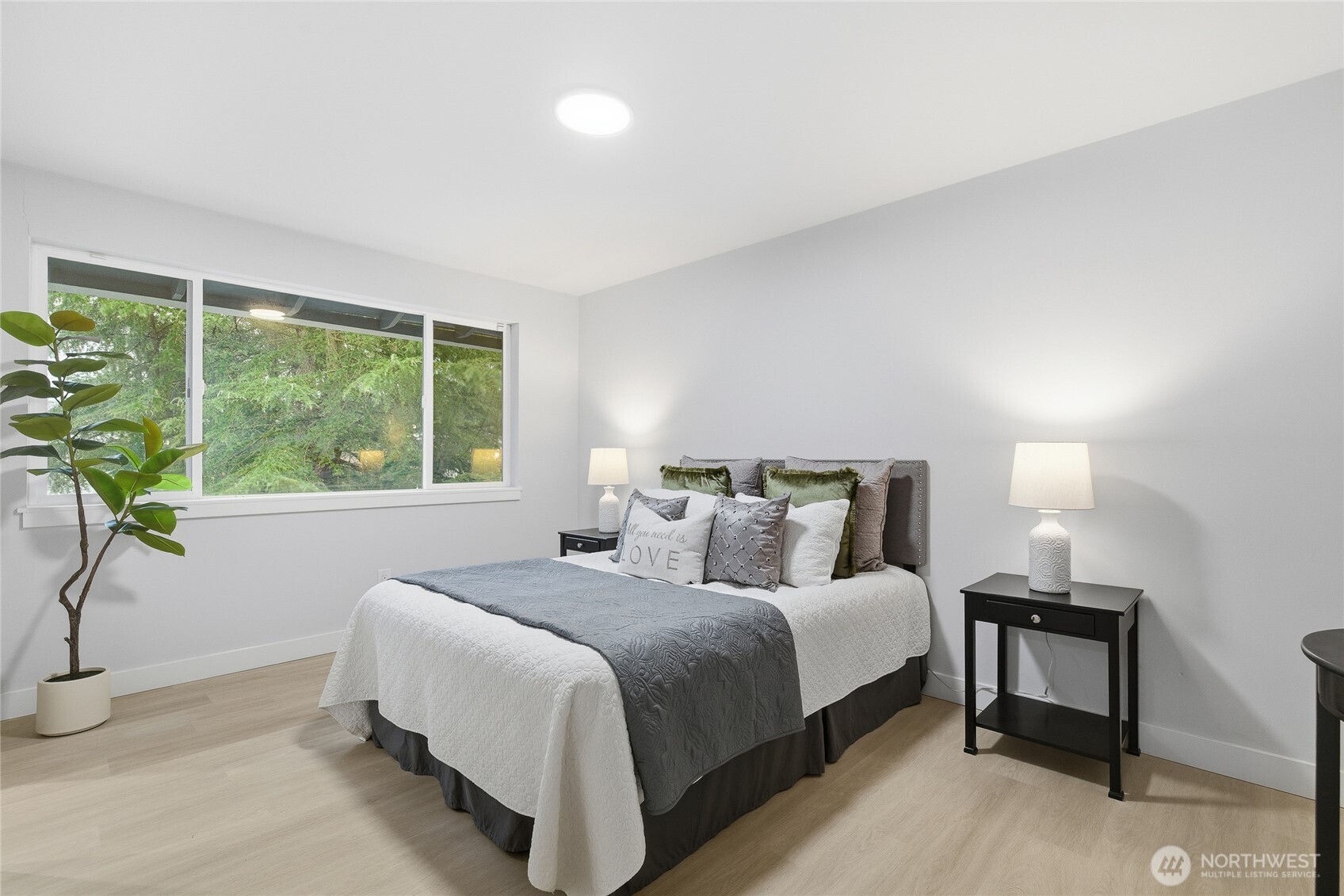 4426 Northeast 17th Street Renton, WA 98059 - Photo 17 of 36 a bedroom with a bed and a window