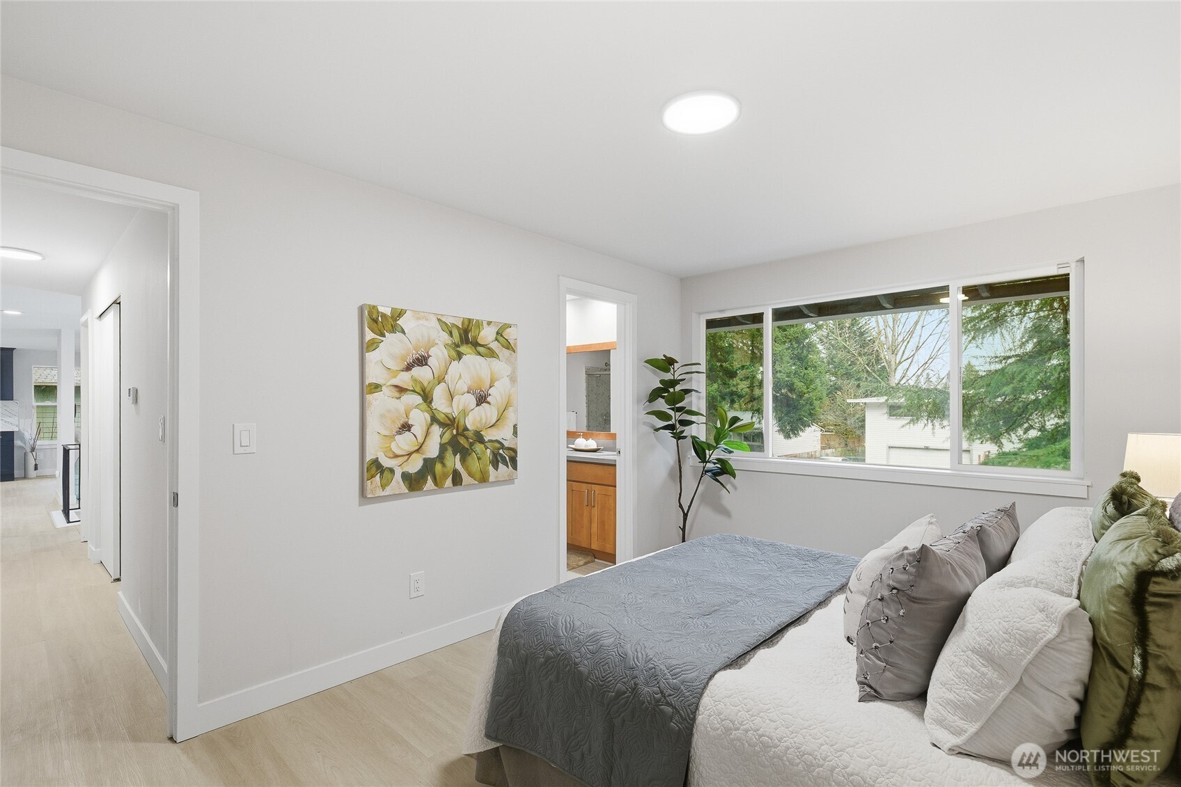 4426 Northeast 17th Street Renton, WA 98059 - Photo 18 of 36 a bed sitting in a bedroom next to a window