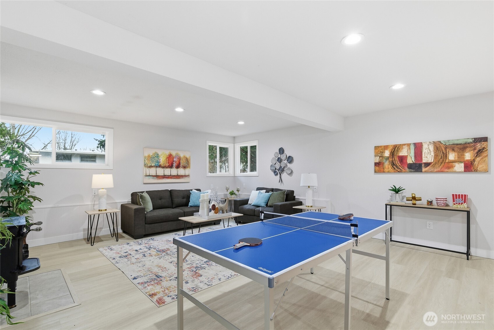 4426 Northeast 17th Street Renton, WA 98059 - Photo 22 of 36 a living room with furniture and a flat screen tv