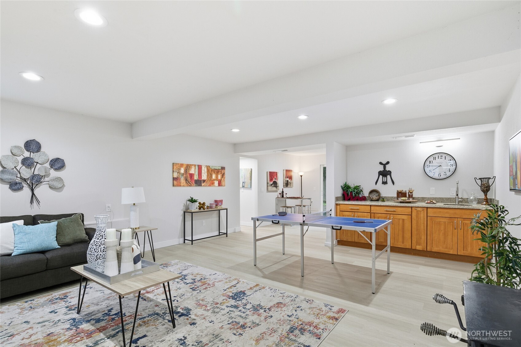 4426 Northeast 17th Street Renton, WA 98059 - Photo 25 of 36 a living room with furniture and a dining table with wooden floor
