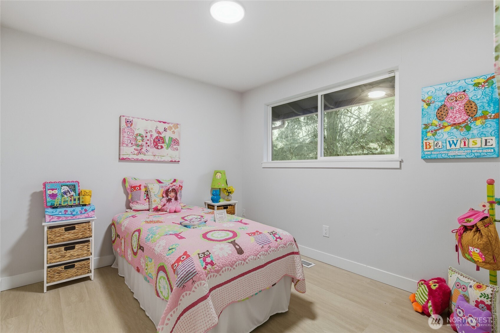 4426 Northeast 17th Street Renton, WA 98059 - Photo 27 of 36 a bedroom with a bed and a window