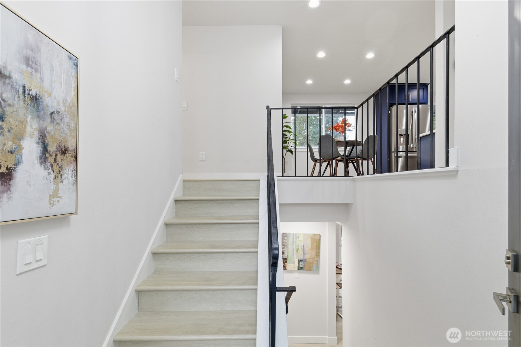 4426 Northeast 17th Street Renton, WA 98059 - Photo 3 of 36 a view of entryway with stairs and a chandelier