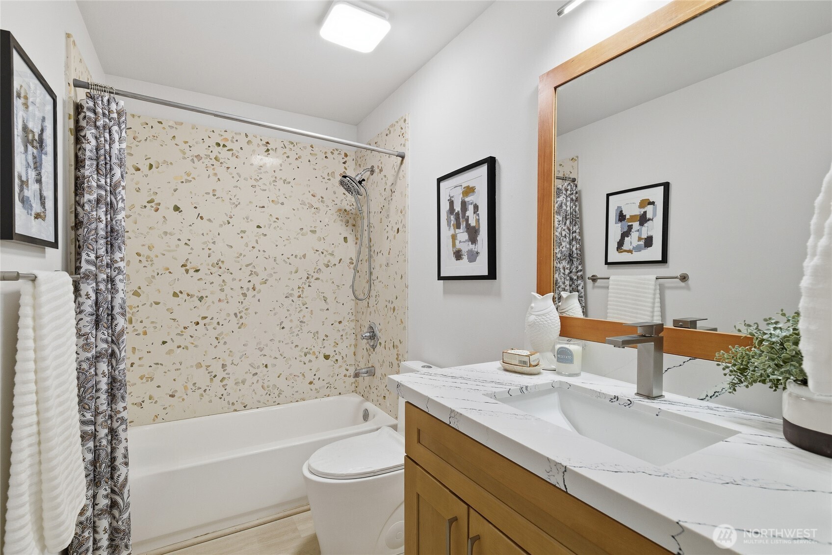 4426 Northeast 17th Street Renton, WA 98059 - Photo 31 of 36 a bathroom with a sink a toilet and shower