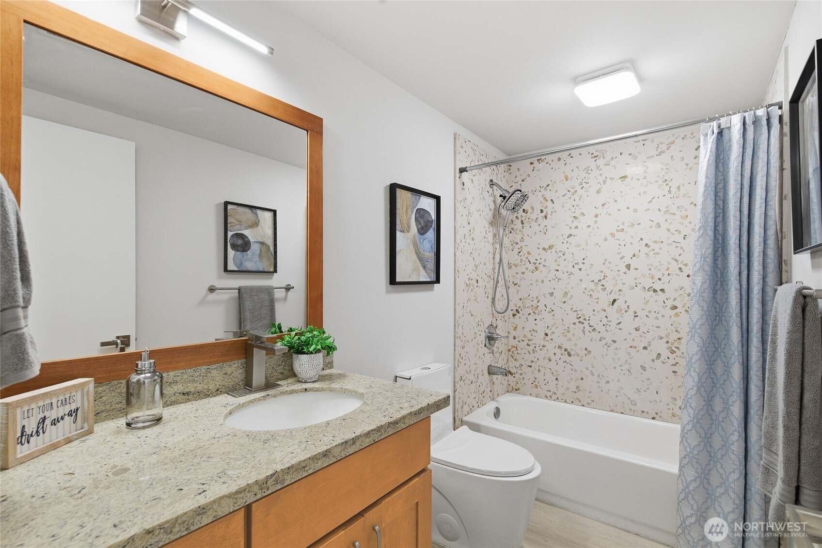4426 Northeast 17th Street Renton, WA 98059 - Photo 32 of 36 a bathroom with a granite countertop sink toilet and shower