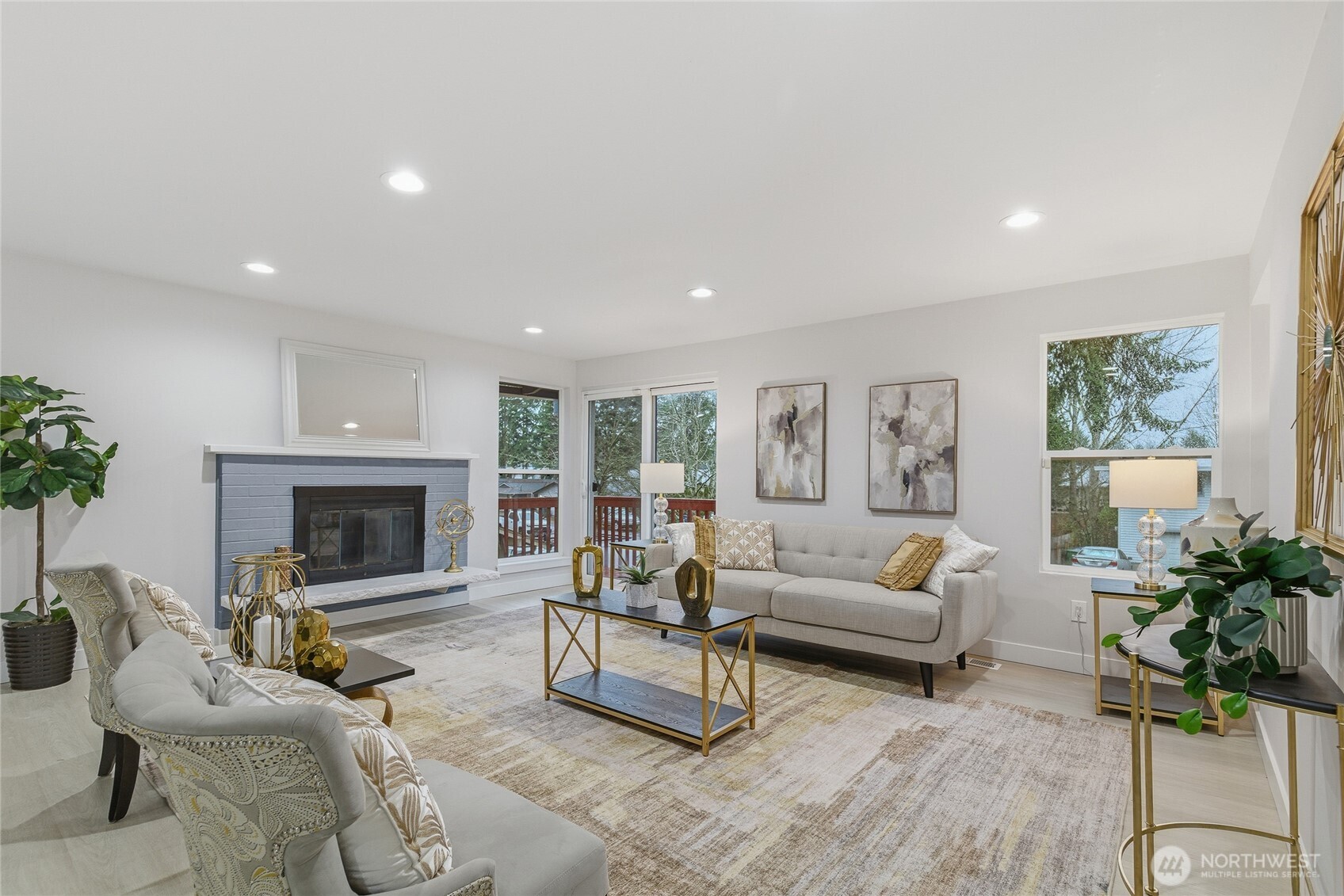 4426 Northeast 17th Street Renton, WA 98059 - Photo 4 of 36 a living room with furniture large window and a fireplace