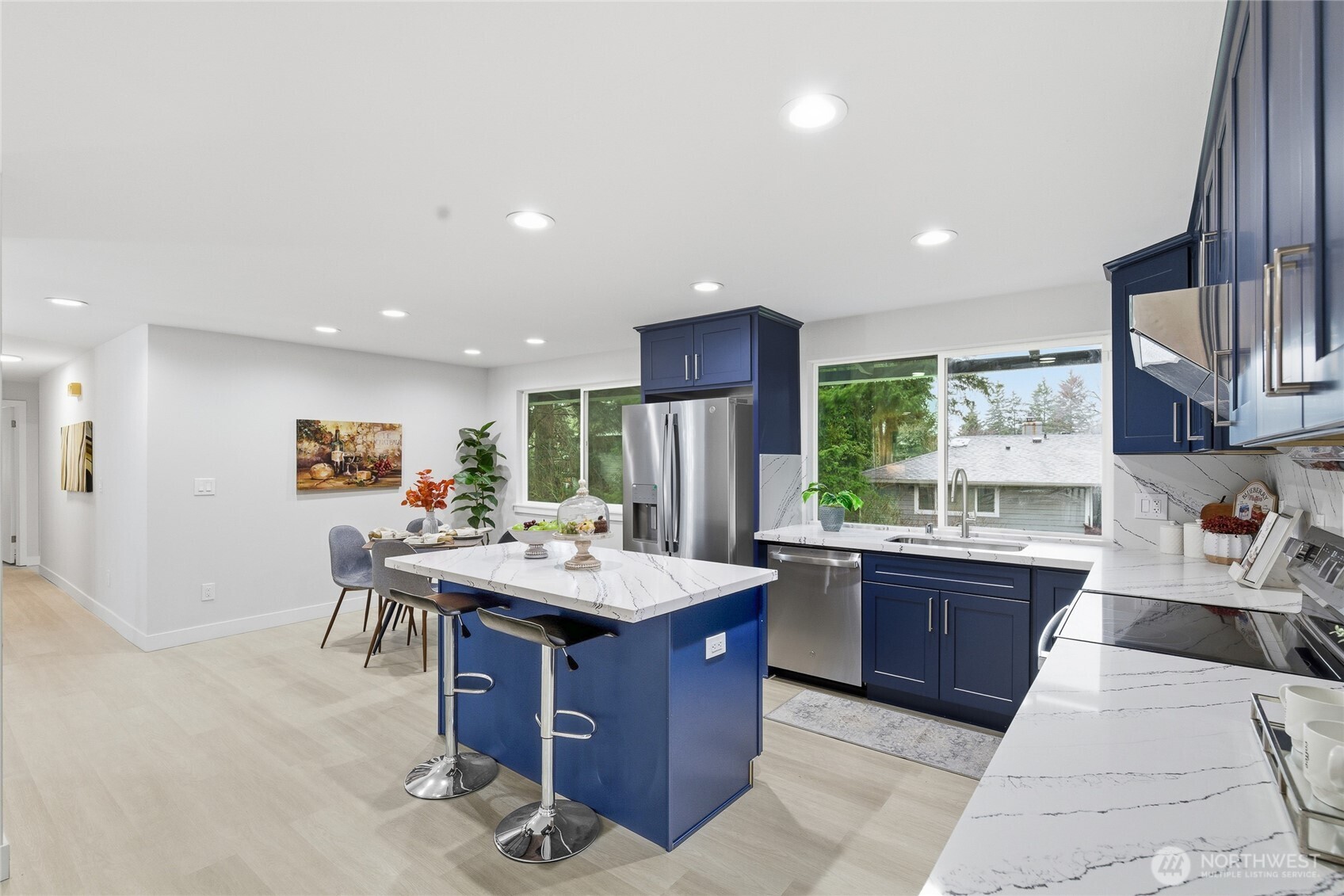 4426 Northeast 17th Street Renton, WA 98059 - Photo 10 of 36 a large kitchen with a table and chairs
