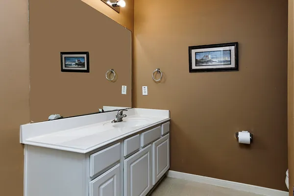 a living room with furniture and a ceiling fan