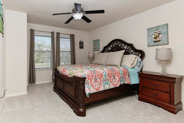 a front view of a house with a yard fire pit and outdoor seating