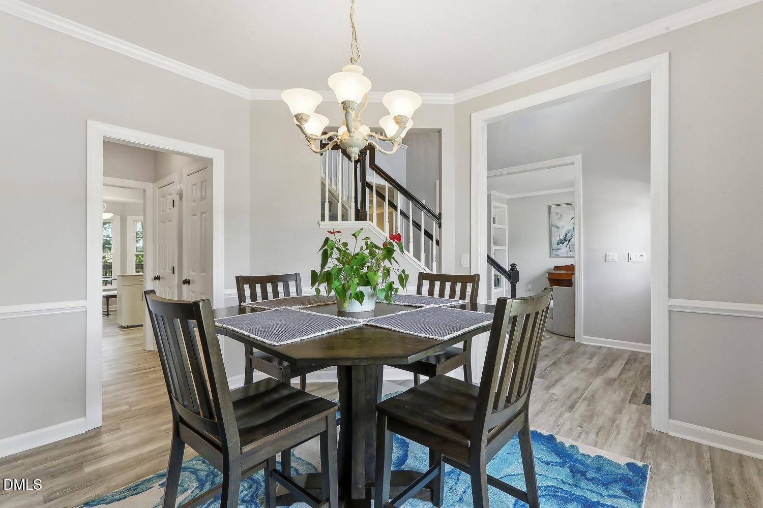4001 Batiste Road Raleigh, NC 27613 - Photo 25 of 63 a view of a dining room with furniture and wooden floor