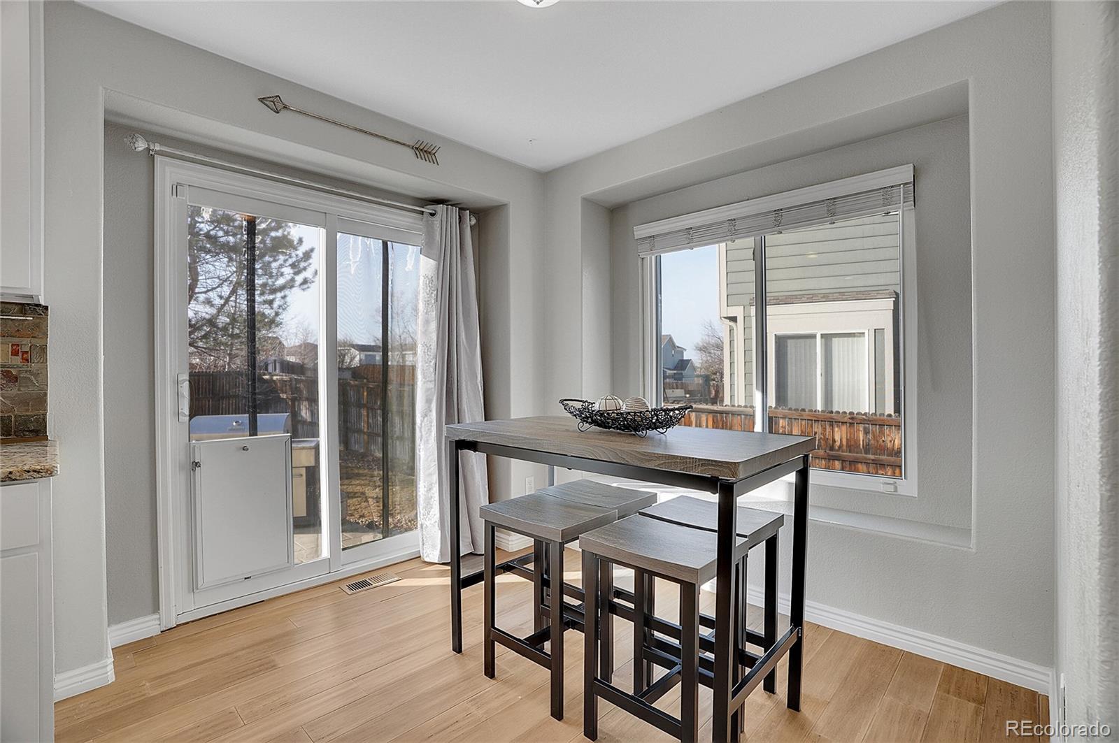 6348 Westview Circle Parker, CO 80134 - Photo 12 of 27 a room with a table chairs and a window