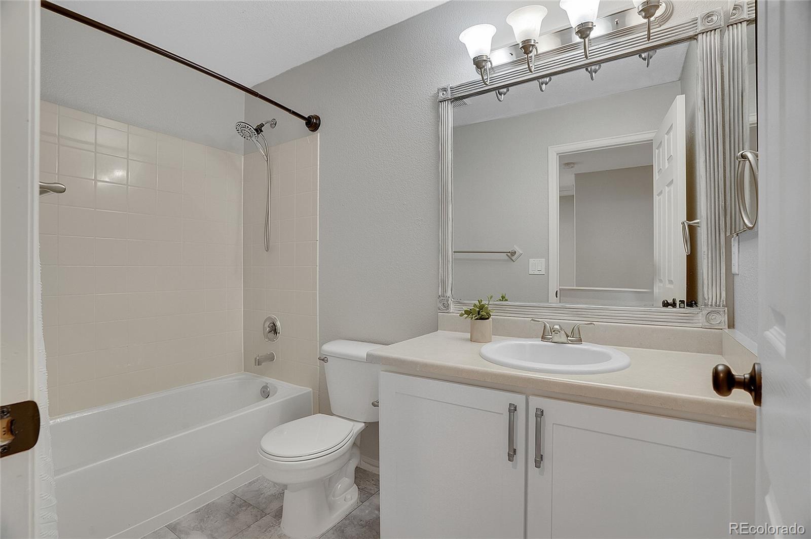 6348 Westview Circle Parker, CO 80134 - Photo 16 of 27 a bathroom with a sink a toilet and shower