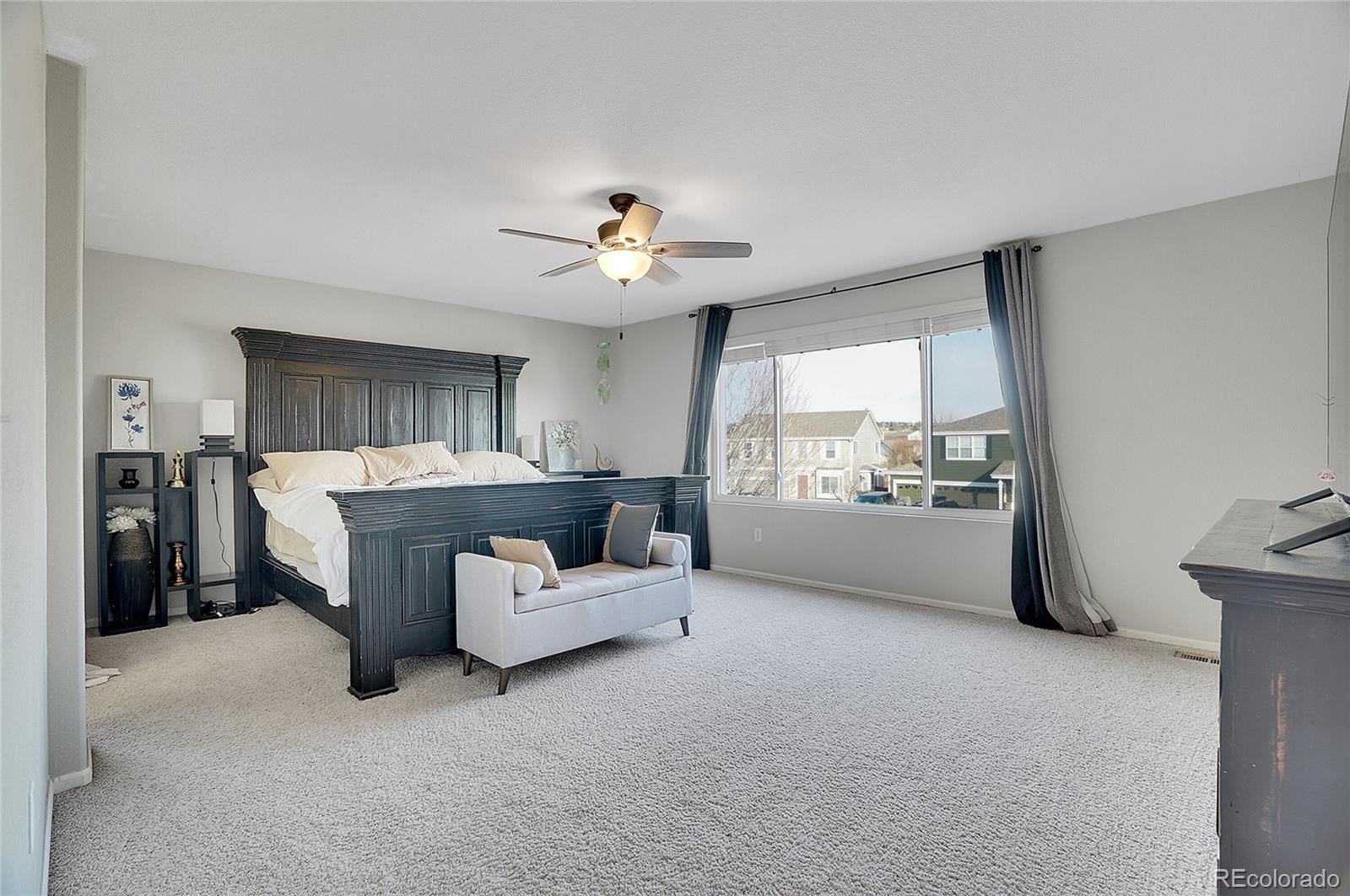 6348 Westview Circle Parker, CO 80134 - Photo 20 of 27 a living room with furniture and a window