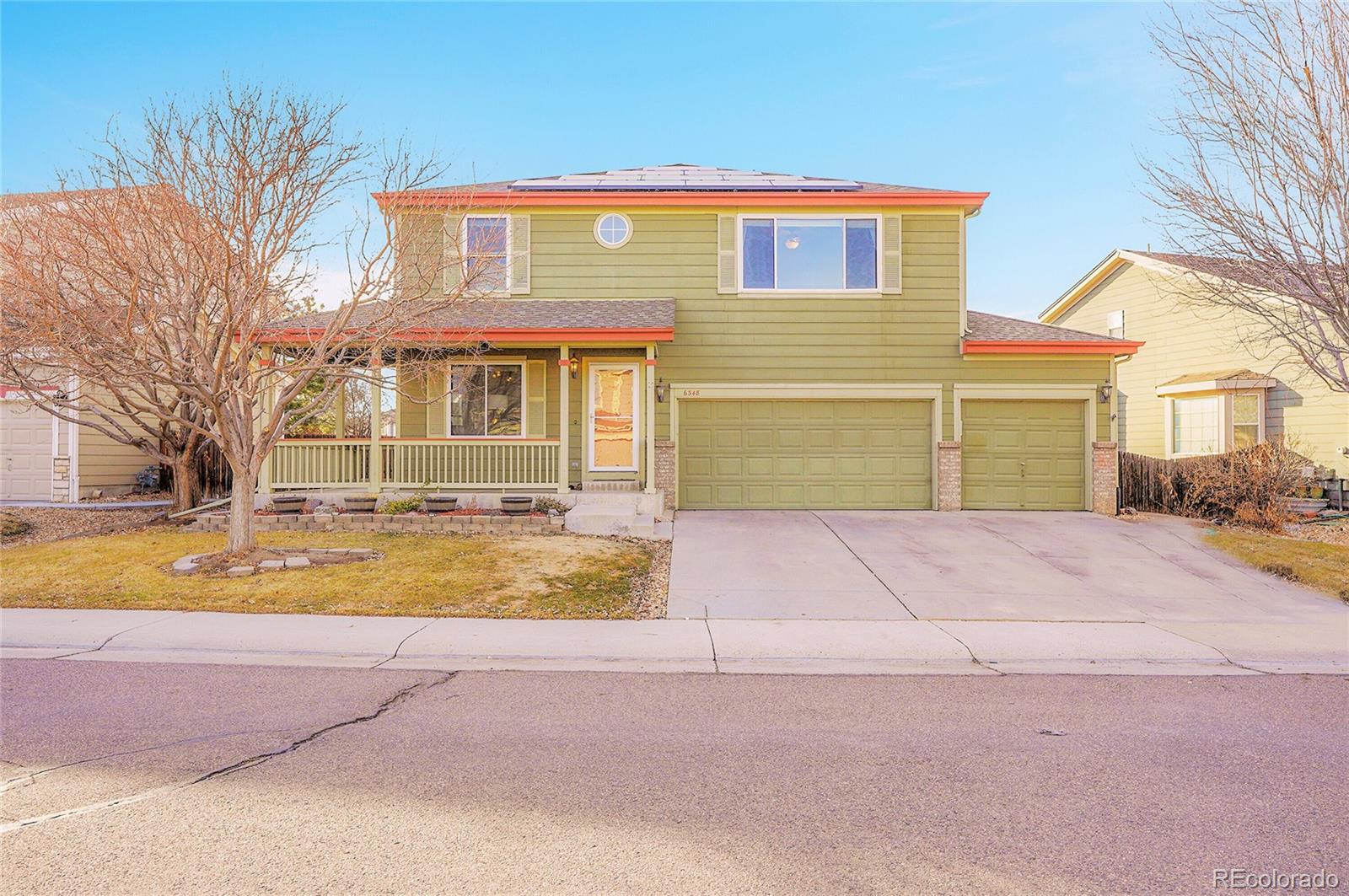 6348 Westview Circle Parker, CO 80134 - Photo 22 of 27 a front view of a house with a yard and garage