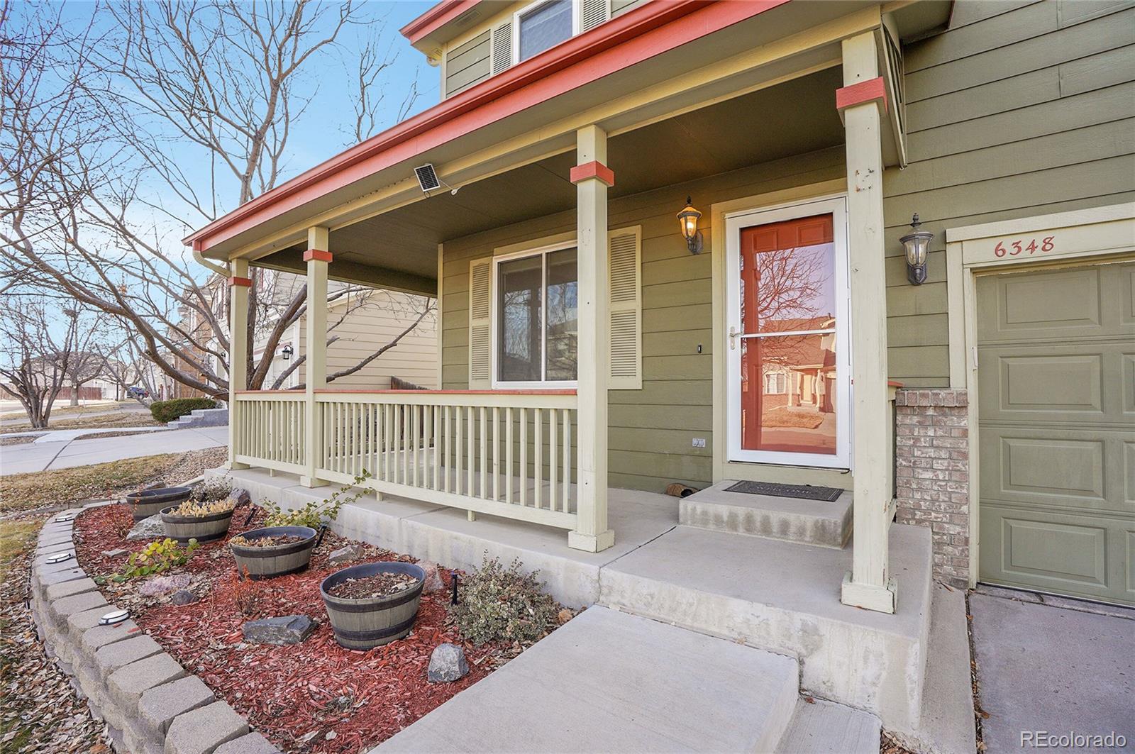 6348 Westview Circle Parker, CO 80134 - Photo 23 of 27 a view of a chair and table on the deck