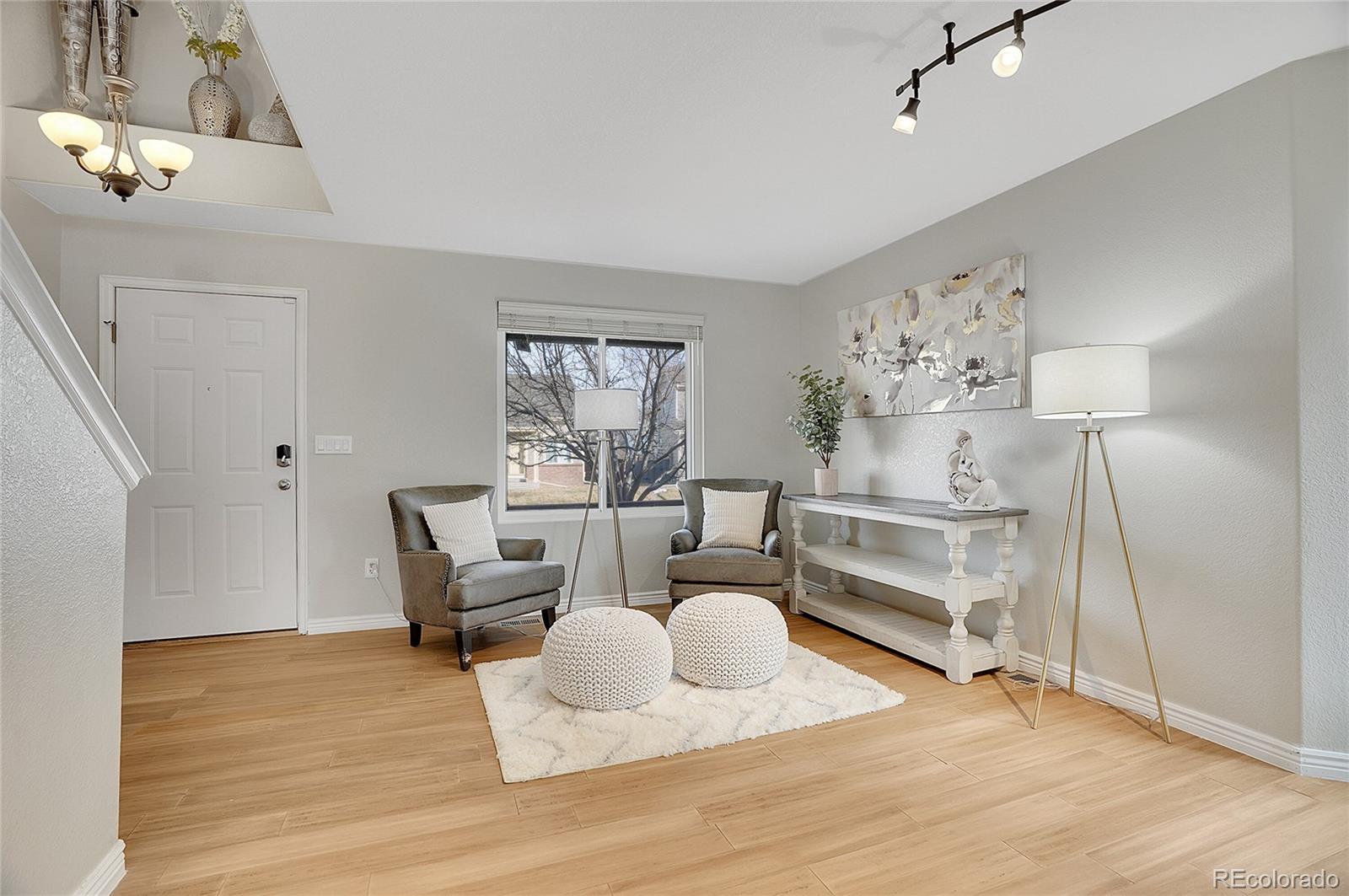 6348 Westview Circle Parker, CO 80134 - Photo 3 of 27 a living room with furniture and a wooden floor