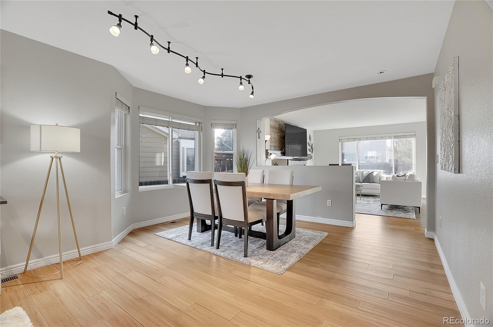 6348 Westview Circle Parker, CO 80134 - Photo 4 of 27 a view of a dining room with furniture and wooden floor