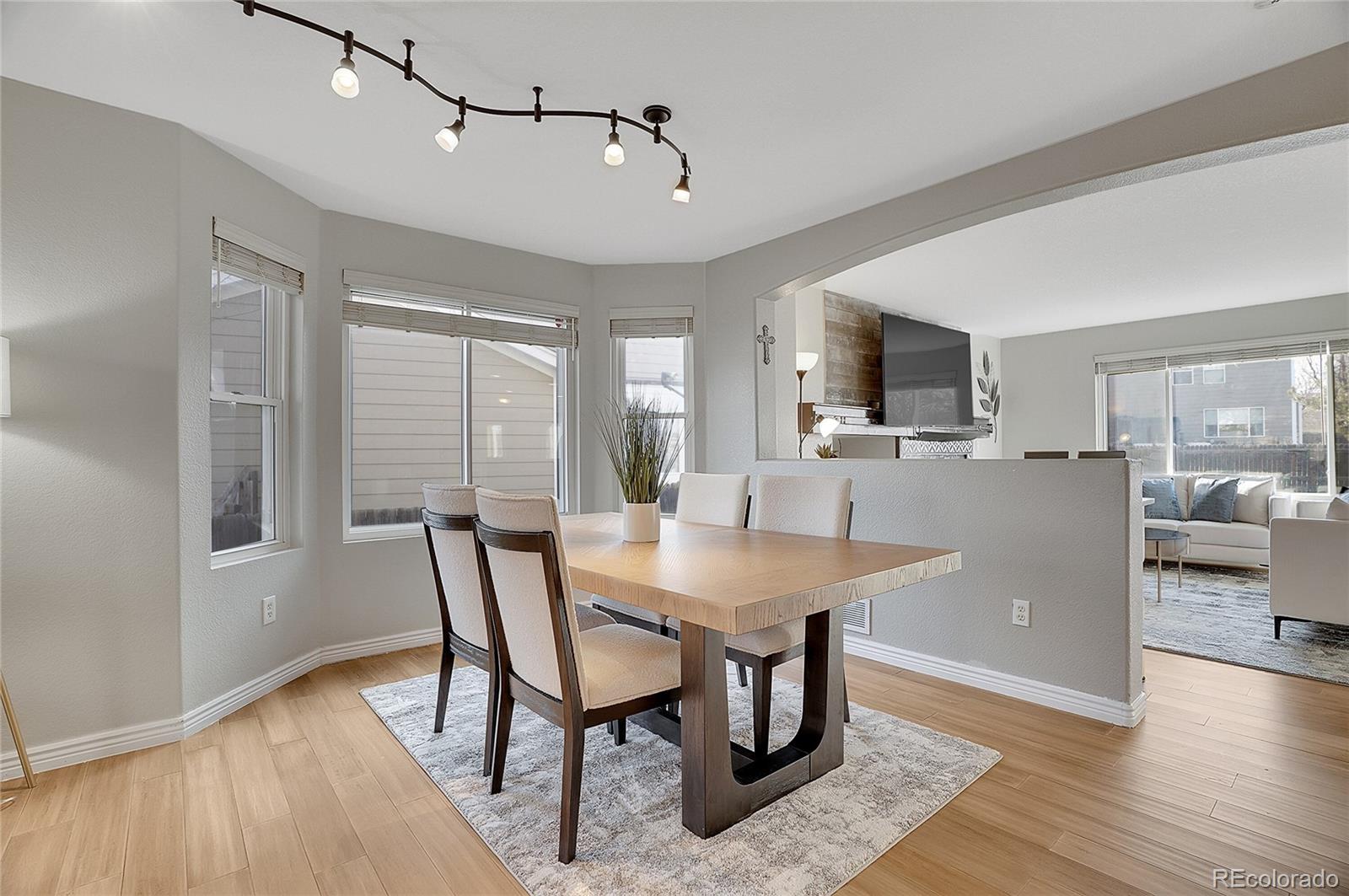 6348 Westview Circle Parker, CO 80134 - Photo 5 of 27 a view of a dining room with furniture window and wooden floor