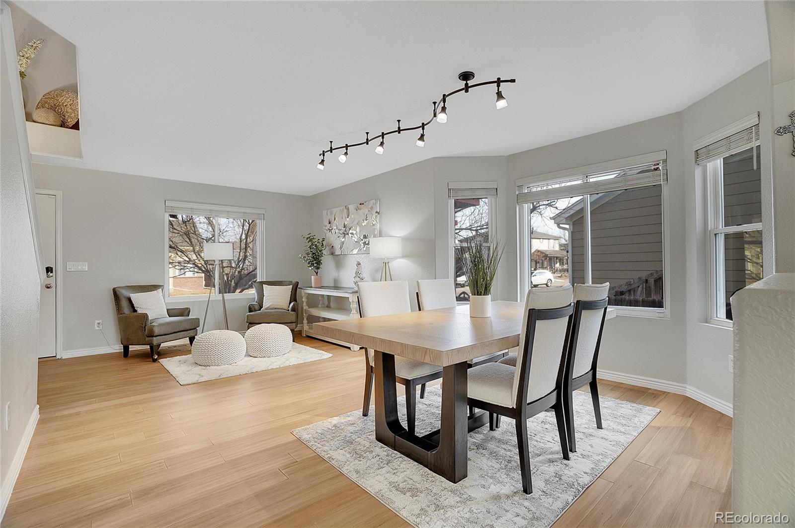 6348 Westview Circle Parker, CO 80134 - Photo 6 of 27 a view of a dining room with furniture and wooden floor