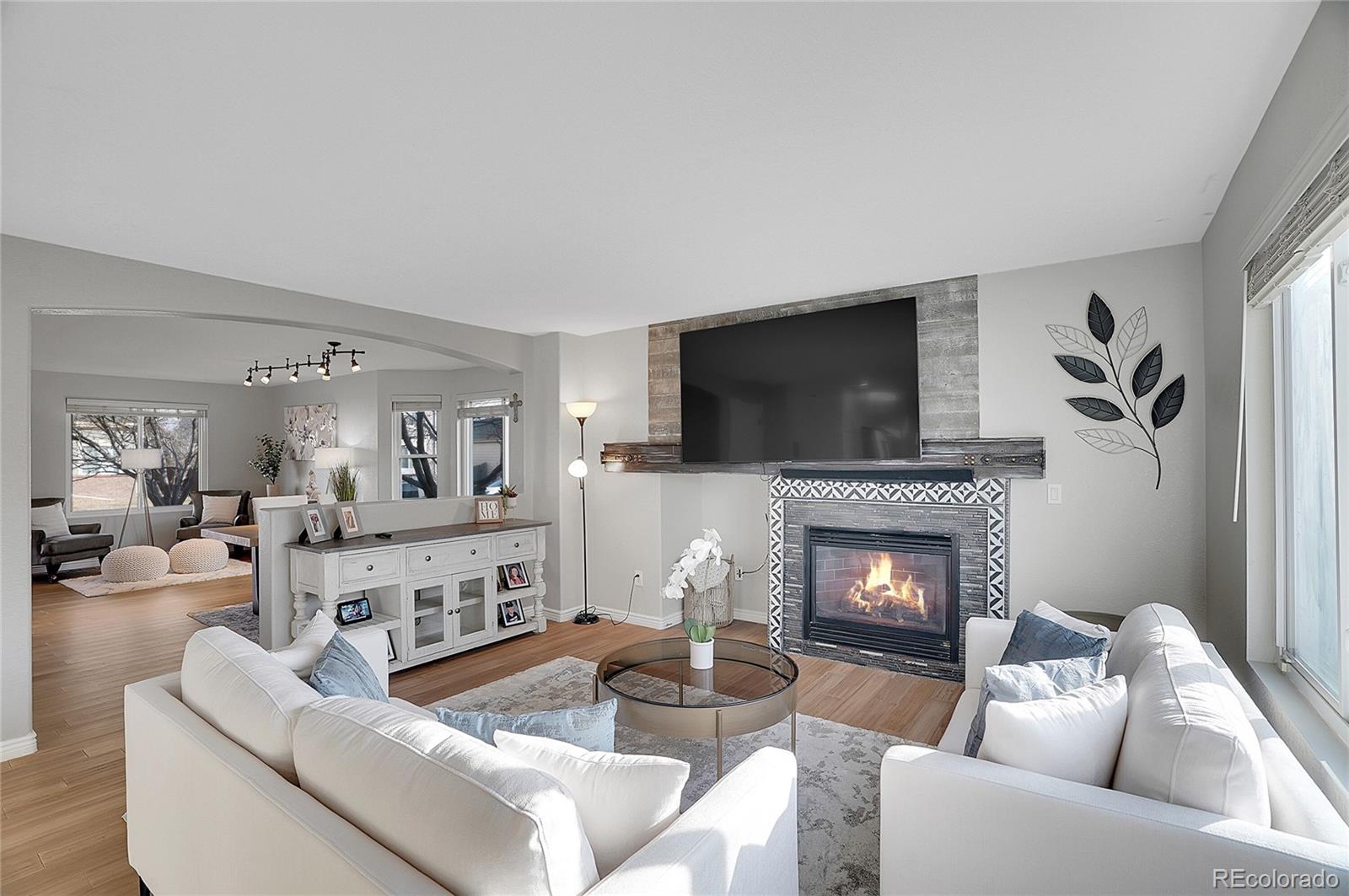 6348 Westview Circle Parker, CO 80134 - Photo 8 of 27 a living room with furniture and a fireplace