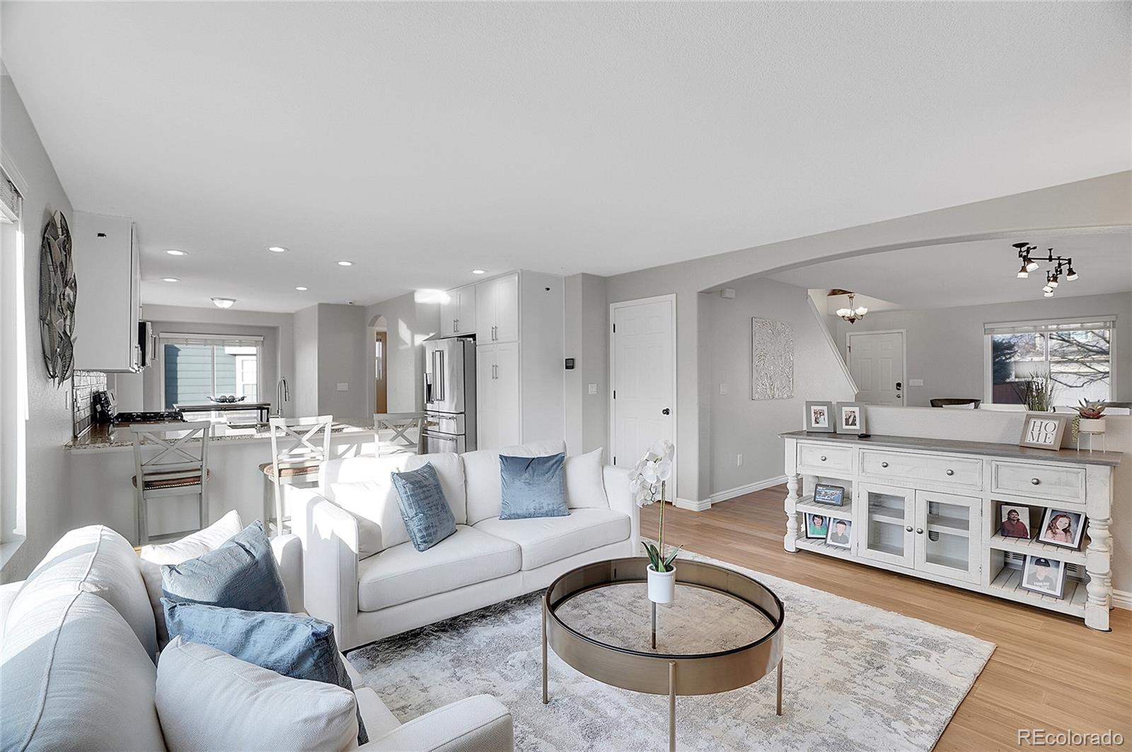 6348 Westview Circle Parker, CO 80134 - Photo 9 of 27 a living room with furniture and a wooden floor