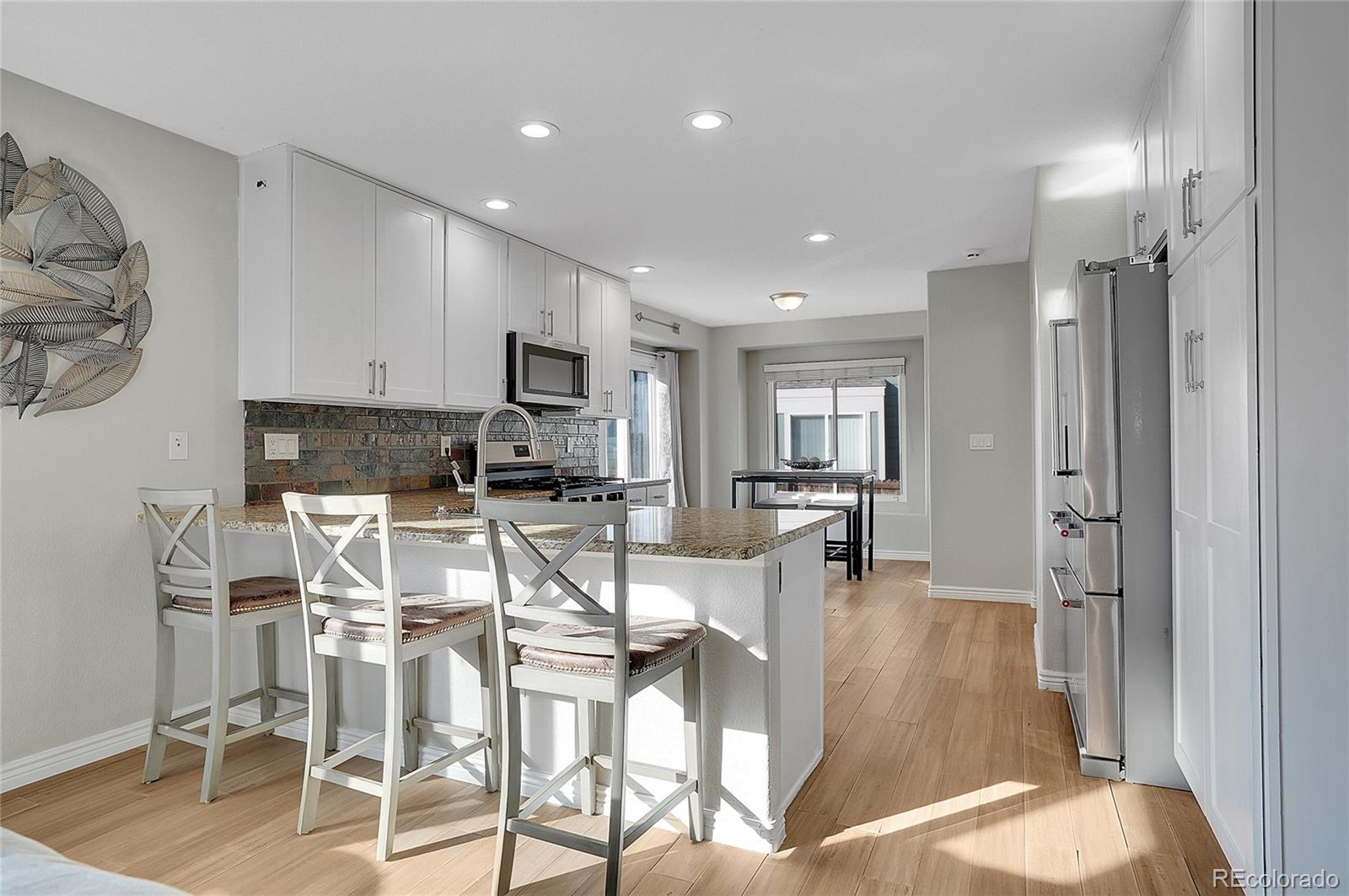 6348 Westview Circle Parker, CO 80134 - Photo 10 of 27 a view of kitchen with dining table and chairs