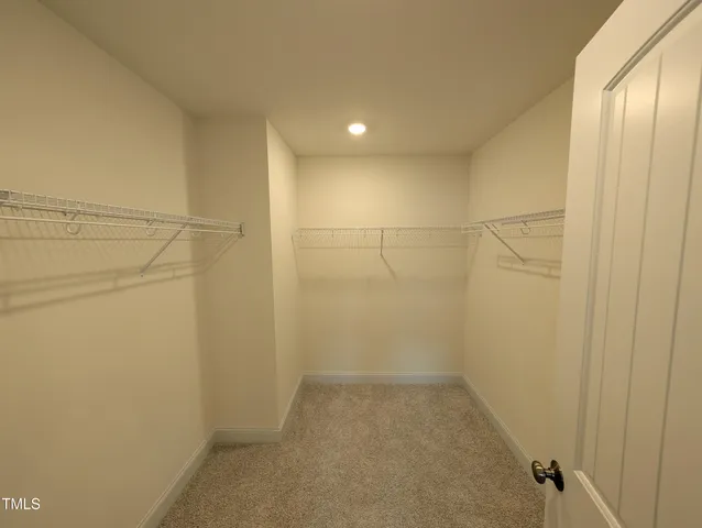 a bathroom with a shower sink and mirror