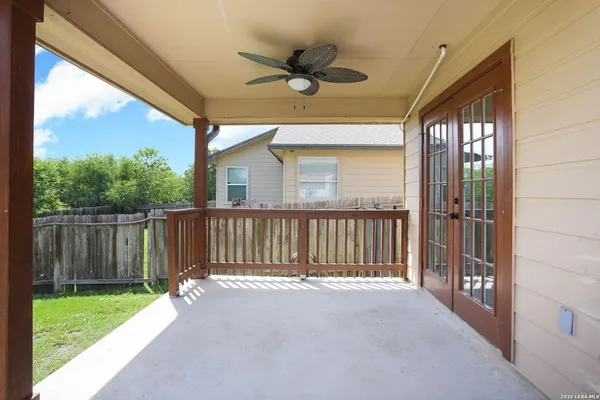 a view of a balcony with a ceiling fan