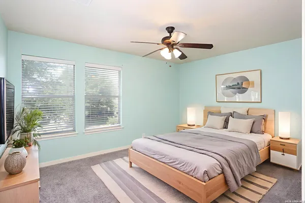 a bedroom with a large bed and a window