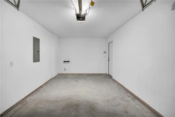 an empty room with a empty space and windows
