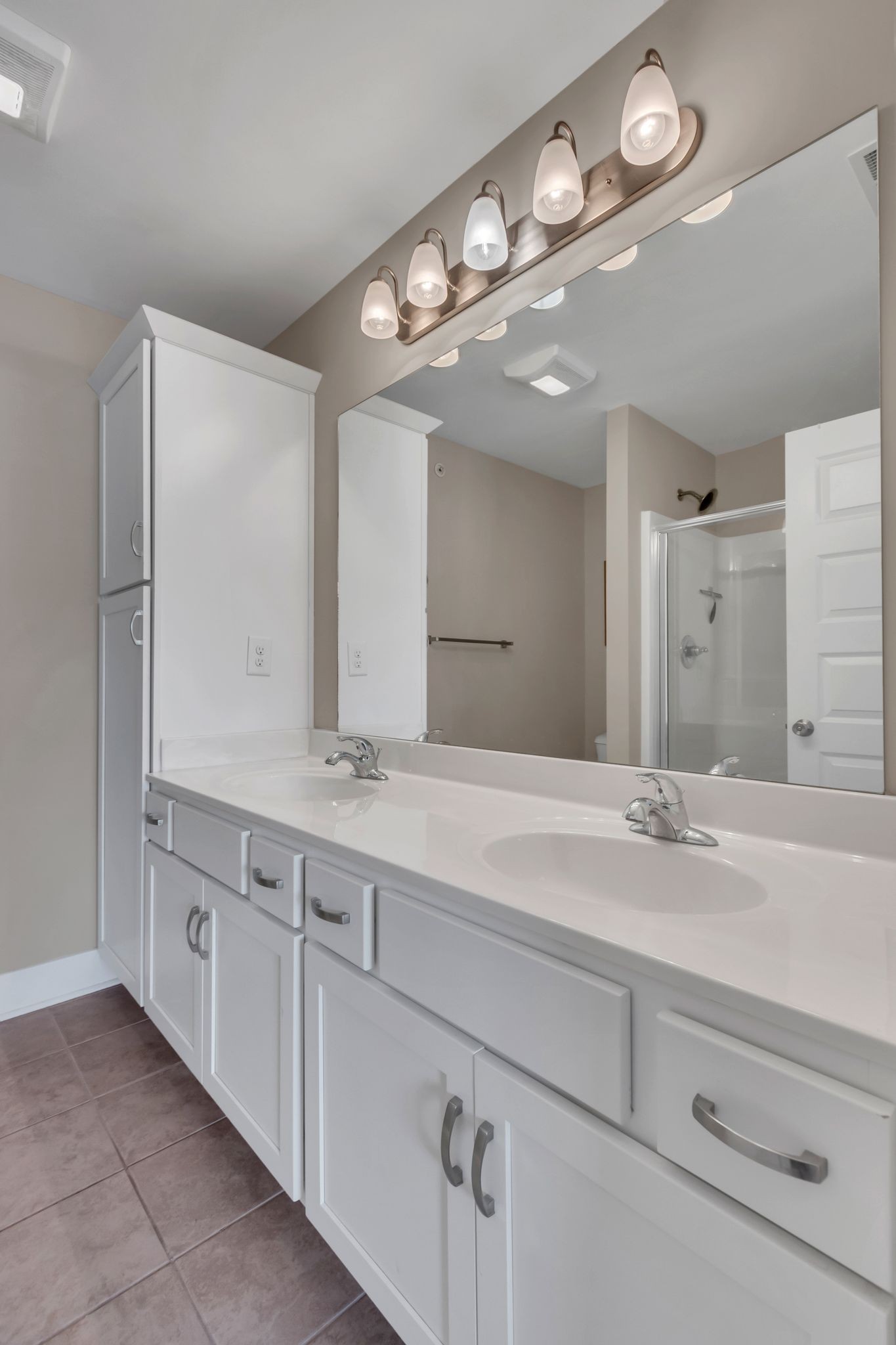 4004 Currant Court Spring Hill, TN 37174 - Photo 20 of 28 a bathroom with double sink and a mirror
