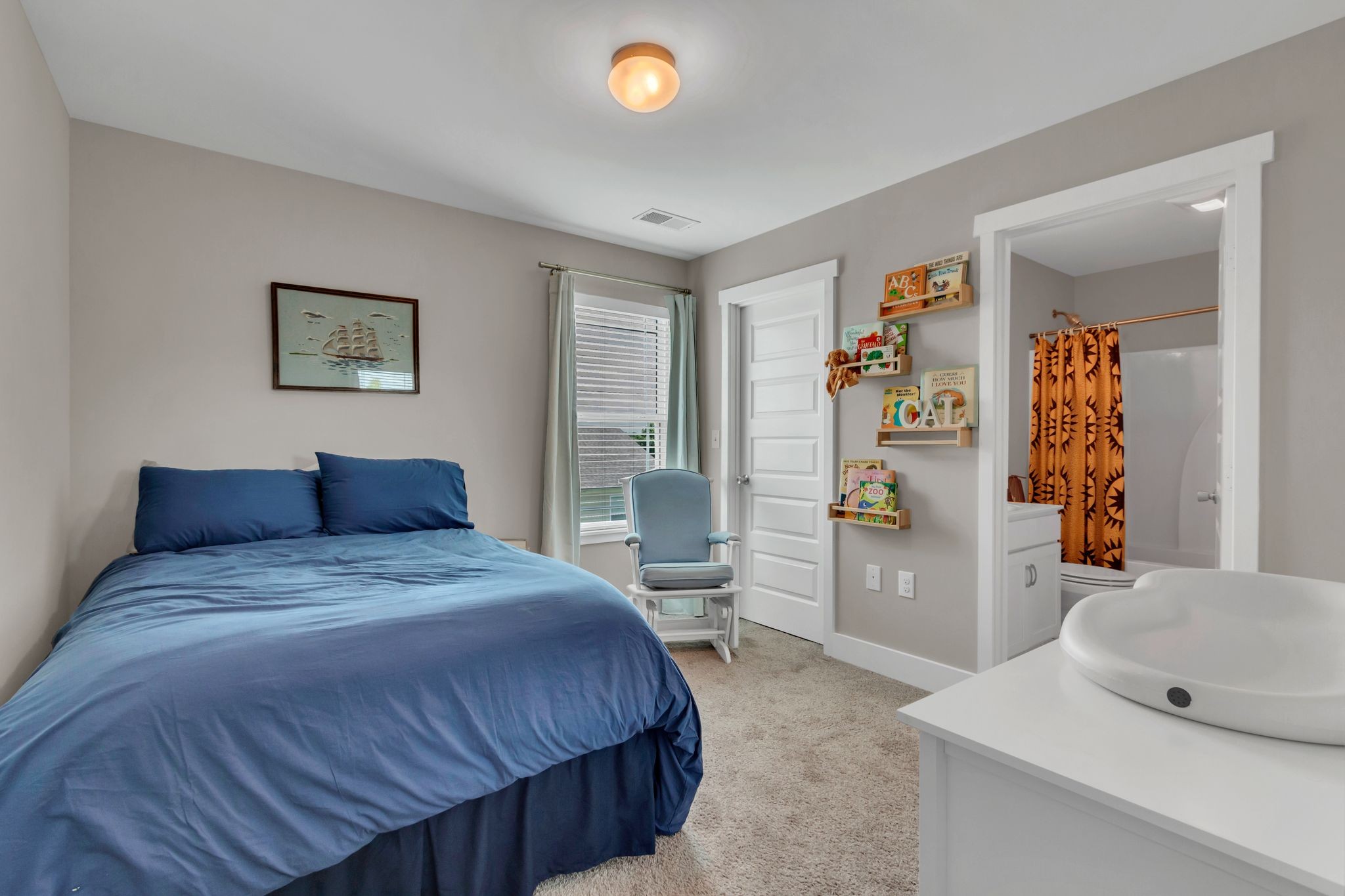 4004 Currant Court Spring Hill, TN 37174 - Photo 22 of 28 a spacious bedroom with a bed and cabinets