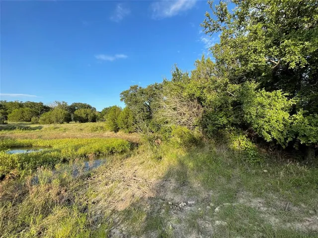 a view of a lake in middle of the town