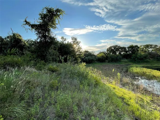 a view of a field with an outdoor space