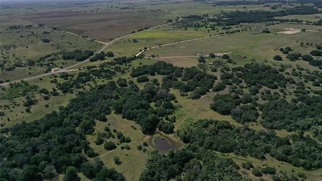 an aerial view of residential house with outdoor space