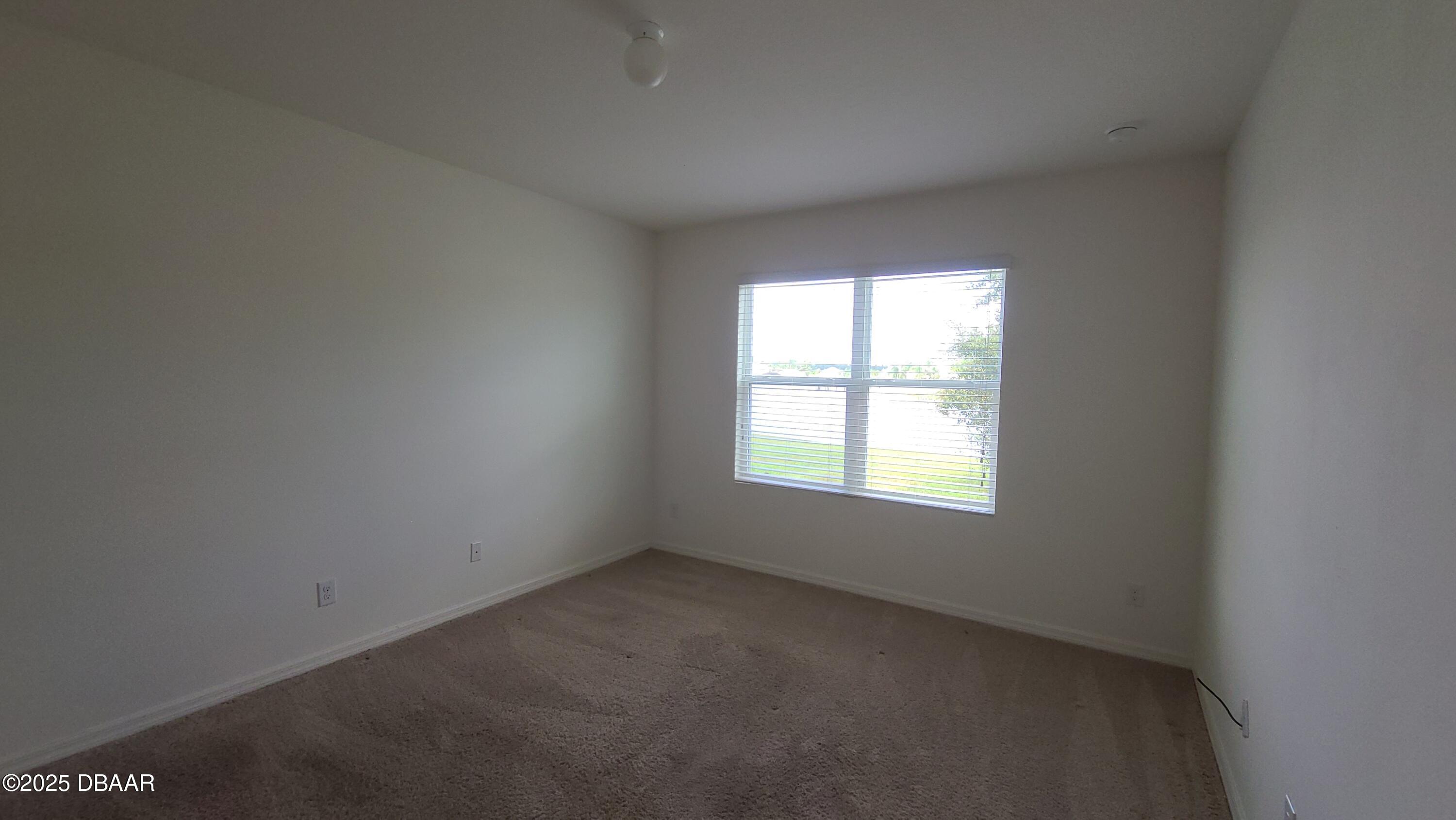 5296 Bear Corn Run Port Orange, FL 32128 - Photo 11 of 31 an empty room with a window