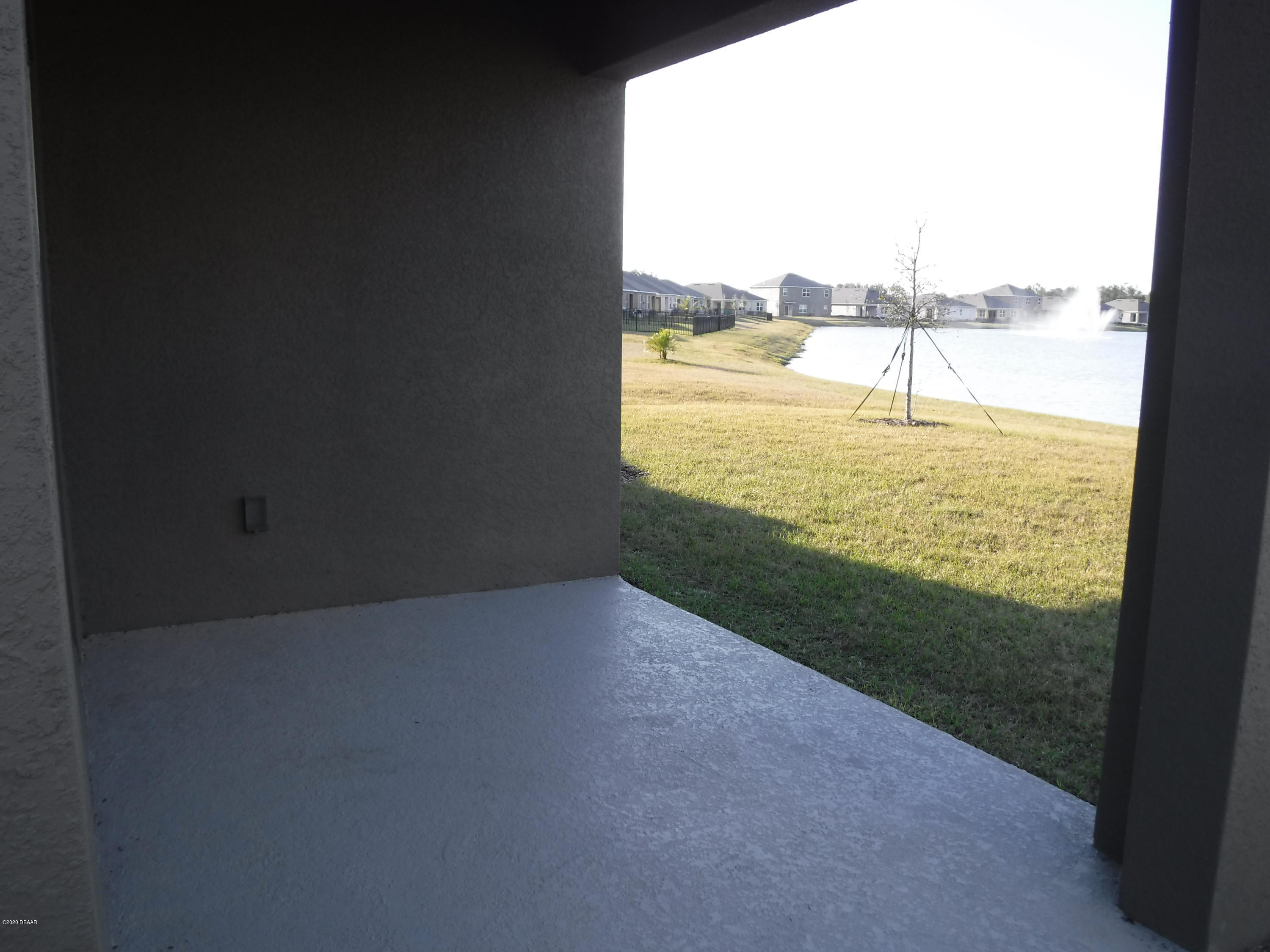 5296 Bear Corn Run Port Orange, FL 32128 - Photo 24 of 31 a view of an ocean and a beach