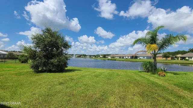 a view of a lake with a big yard
