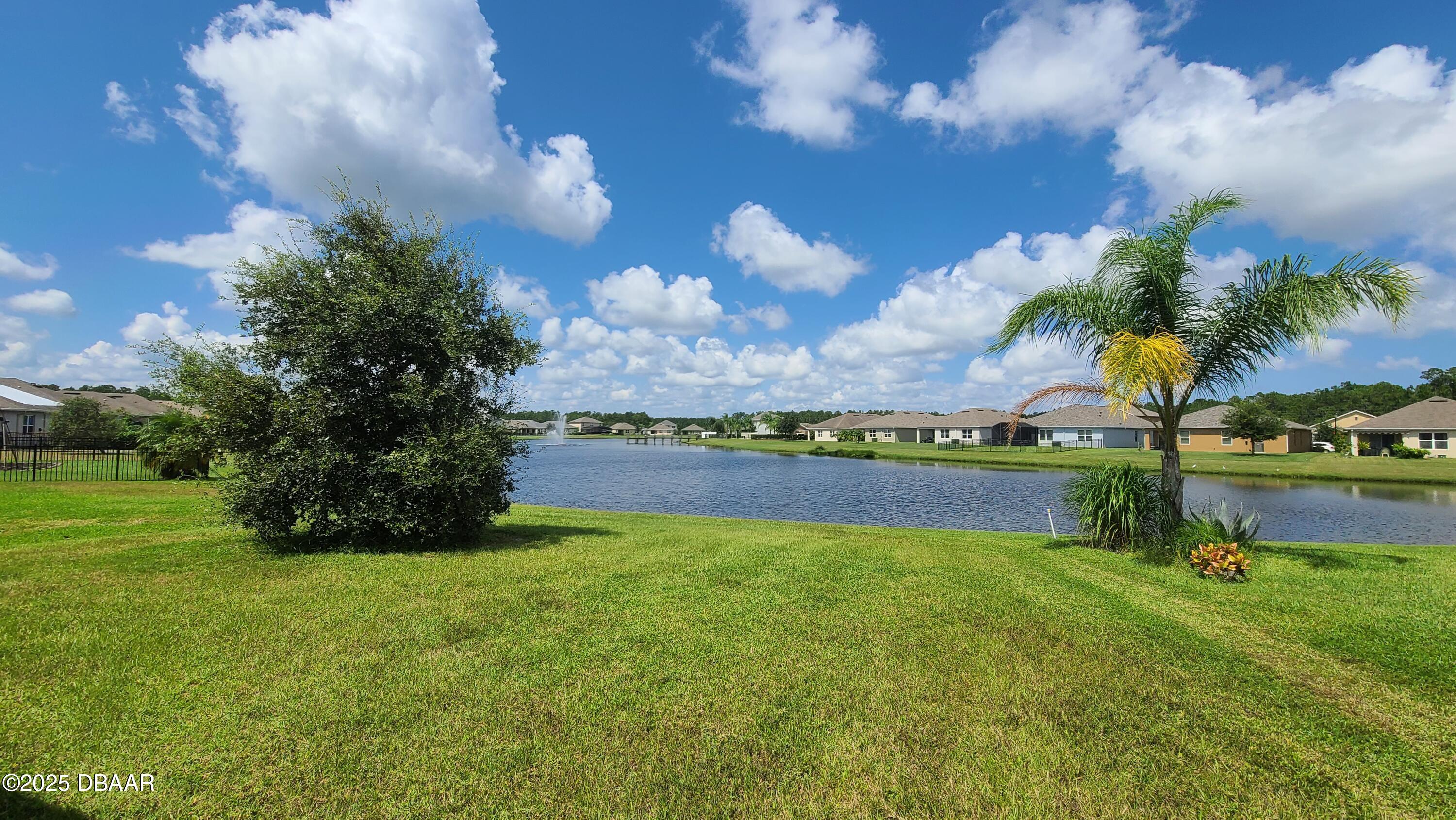 5296 Bear Corn Run Port Orange, FL 32128 - Photo 25 of 31 a view of a lake with a big yard
