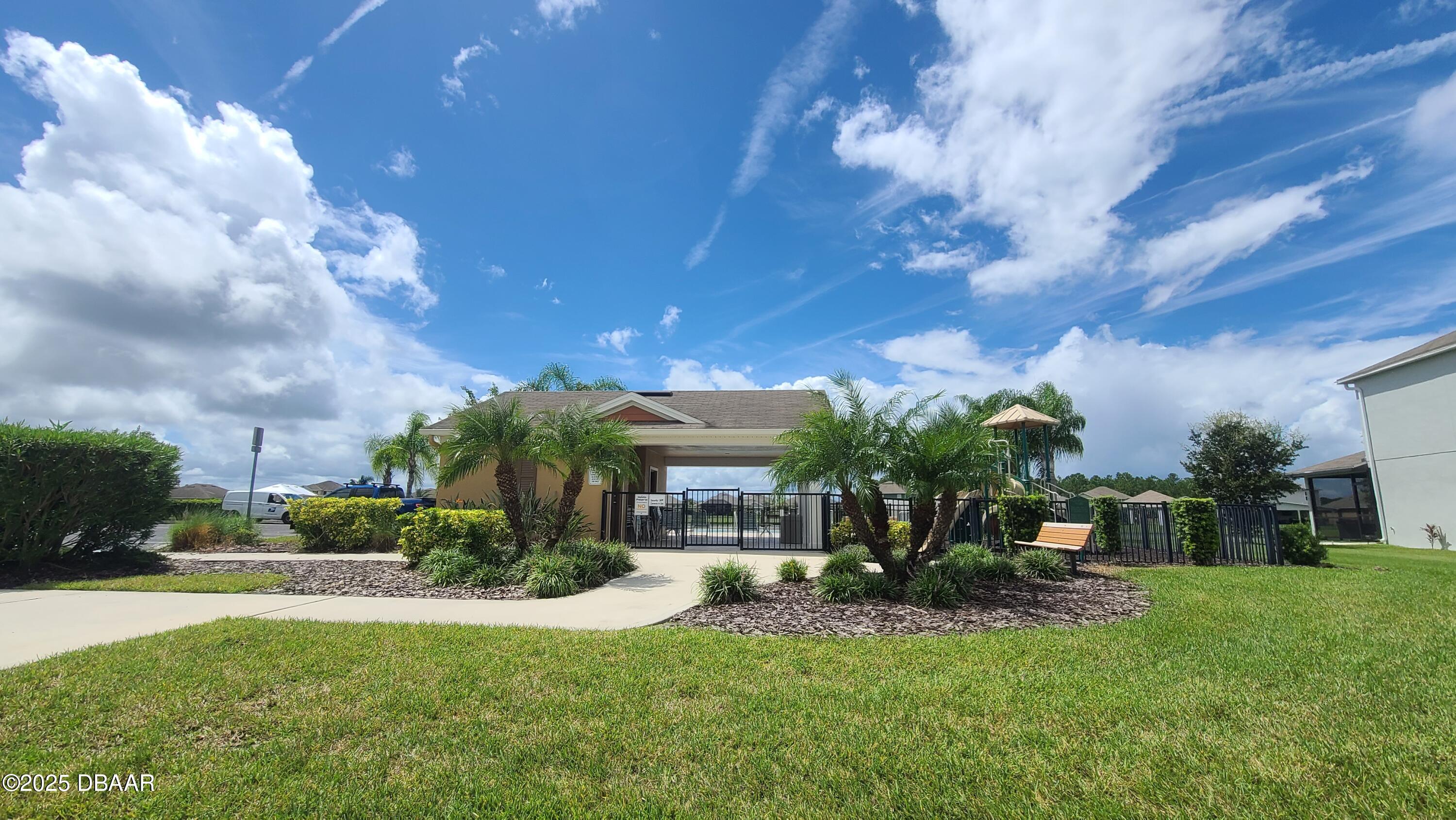 5296 Bear Corn Run Port Orange, FL 32128 - Photo 27 of 31 a view of house with a yard and potted plants