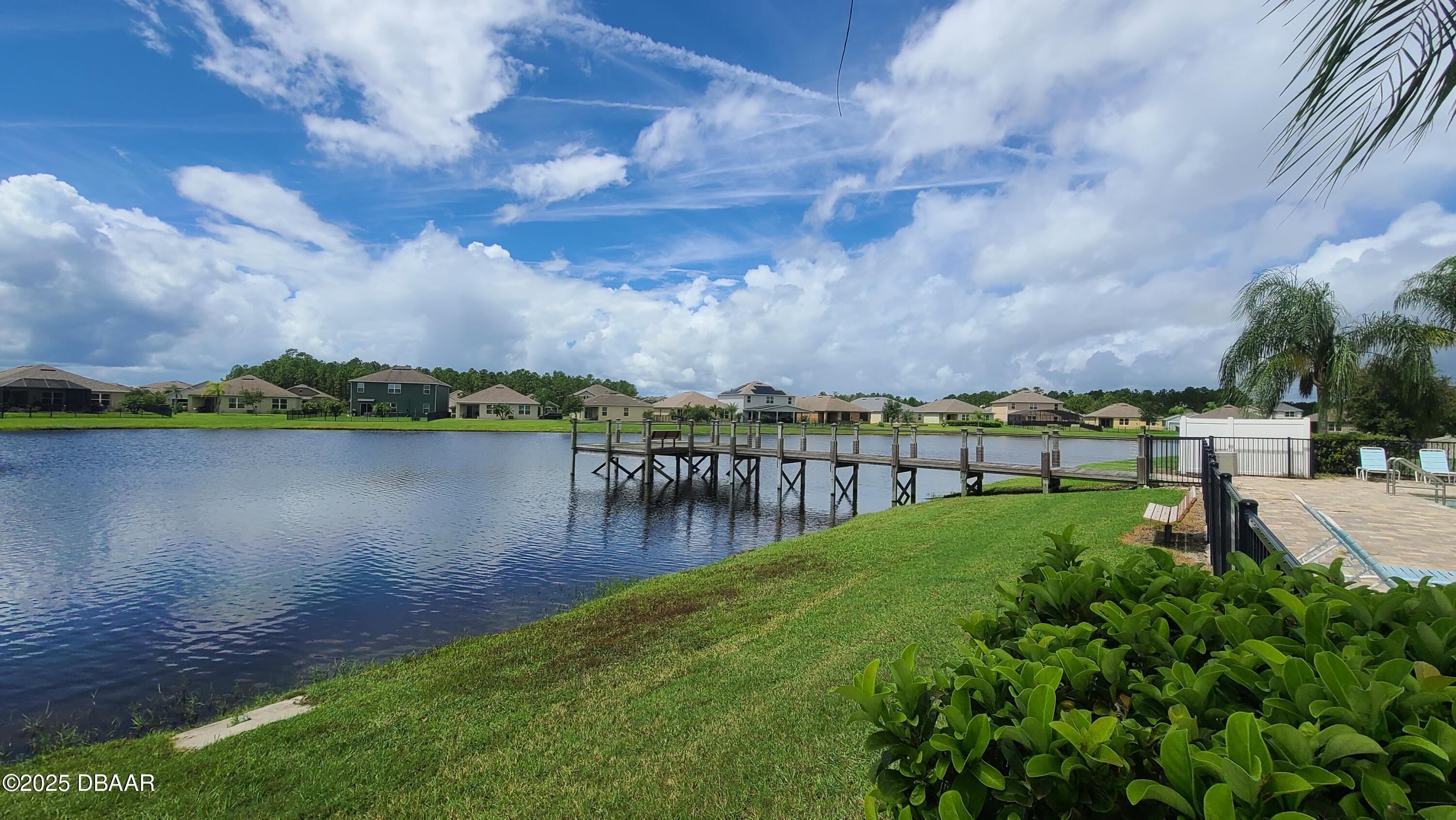 5296 Bear Corn Run Port Orange, FL 32128 - Photo 30 of 31 a view of a lake with houses in the back