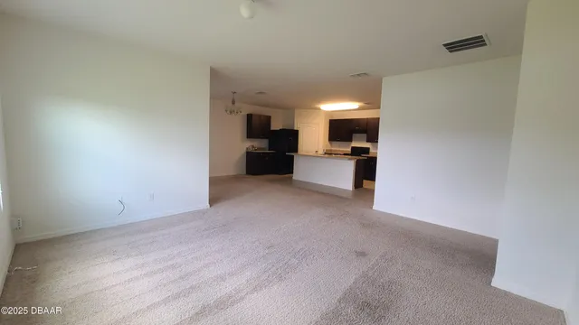 a view of a kitchen with a sink