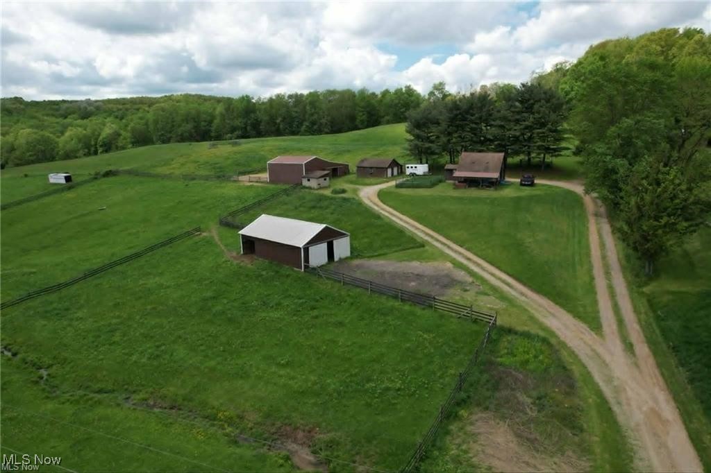 10097 March Road Northeast East Rochester, OH 44625 - Photo 2 of 34 View of property's community featuring an outbuilding, an outdoor structure, a rural view, and a garage