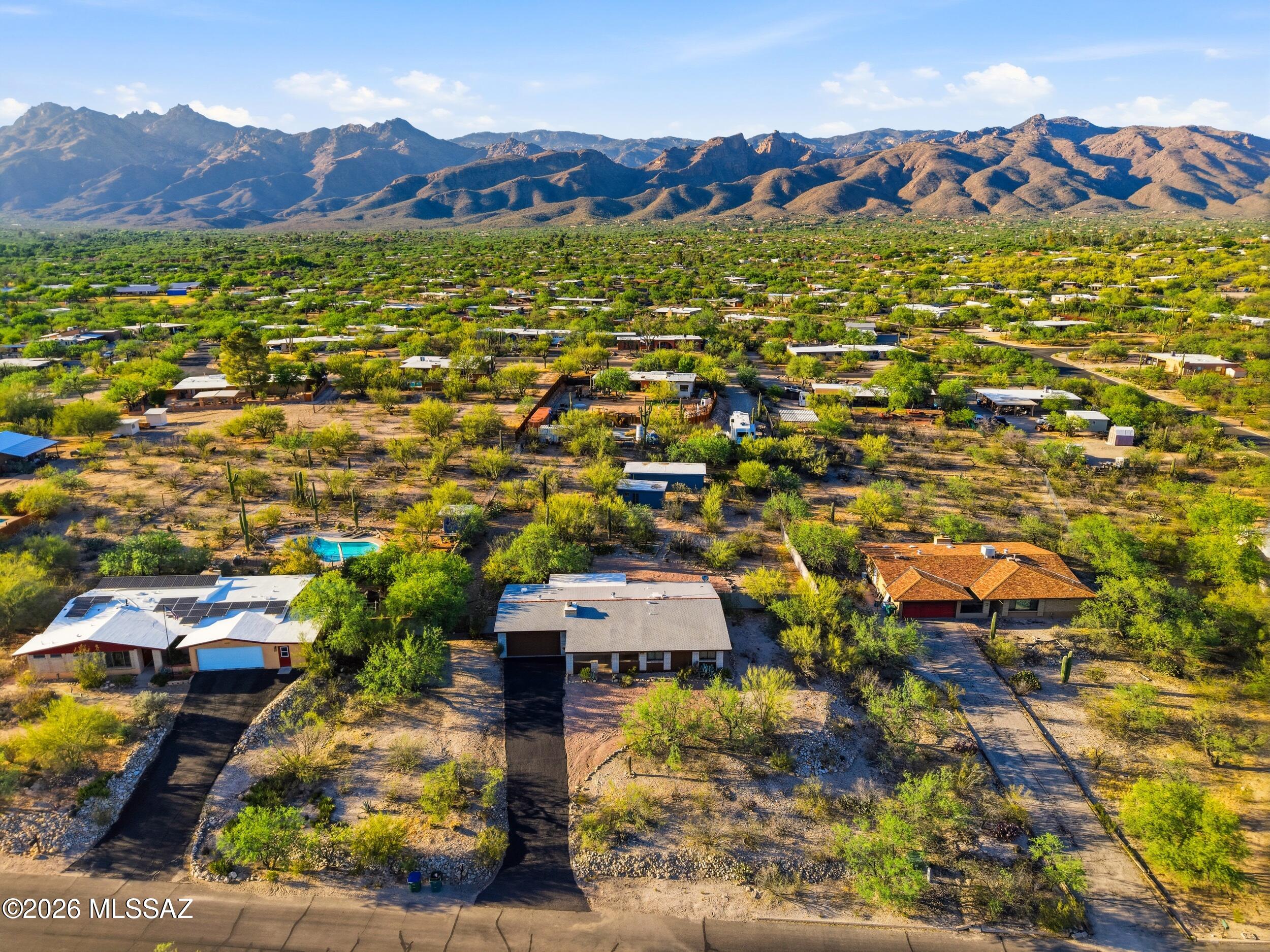 9141 East Indian Canyon Road Tucson, AZ 85749 - Photo 4 of 33 an aerial view of residential houses with outdoor space