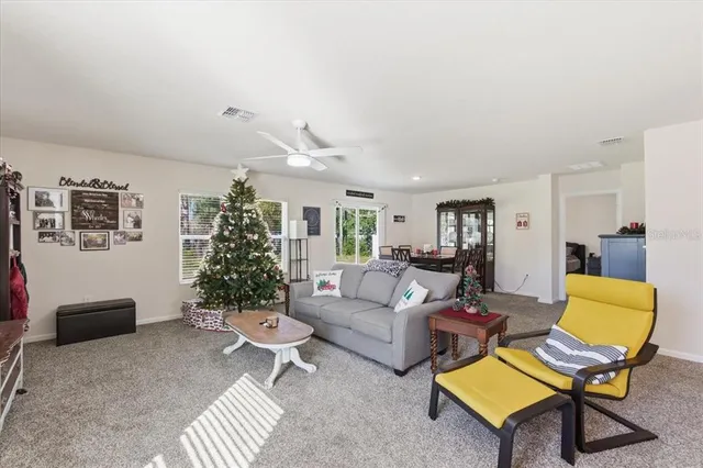 a view of a dining room and livingroom with furniture