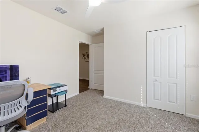 a living room with furniture kitchen and a table