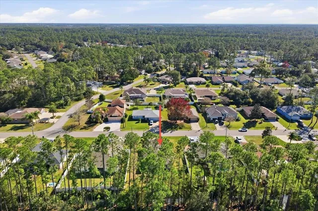 an aerial view of a house with a garden