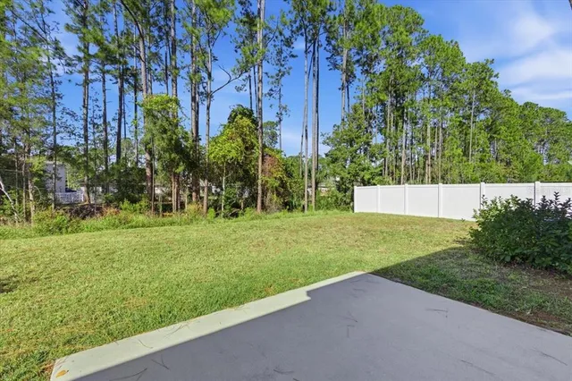 a living room with furniture a lamp and a window