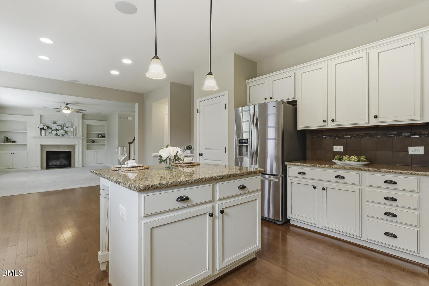 441 Virginia Water Drive Rolesville, NC 27571 - Photo 4 of 20 a kitchen with stainless steel appliances granite countertop a sink and refrigerator