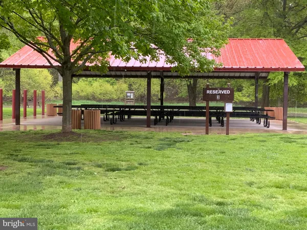 a view of a wooden deck and a yard