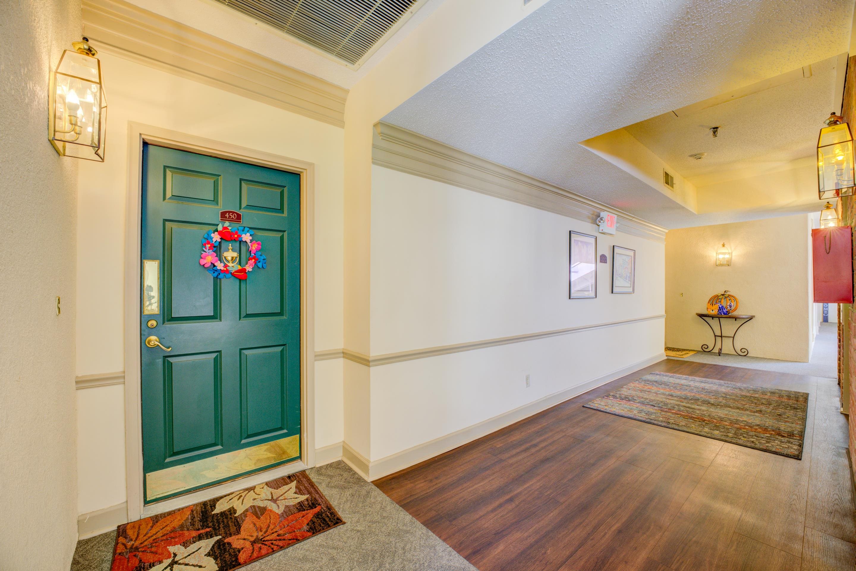 405 South Perkins Road, Unit 450 Memphis, TN 38117 - Photo 16 of 28 a view of a hallway with wooden floor and a refrigerator